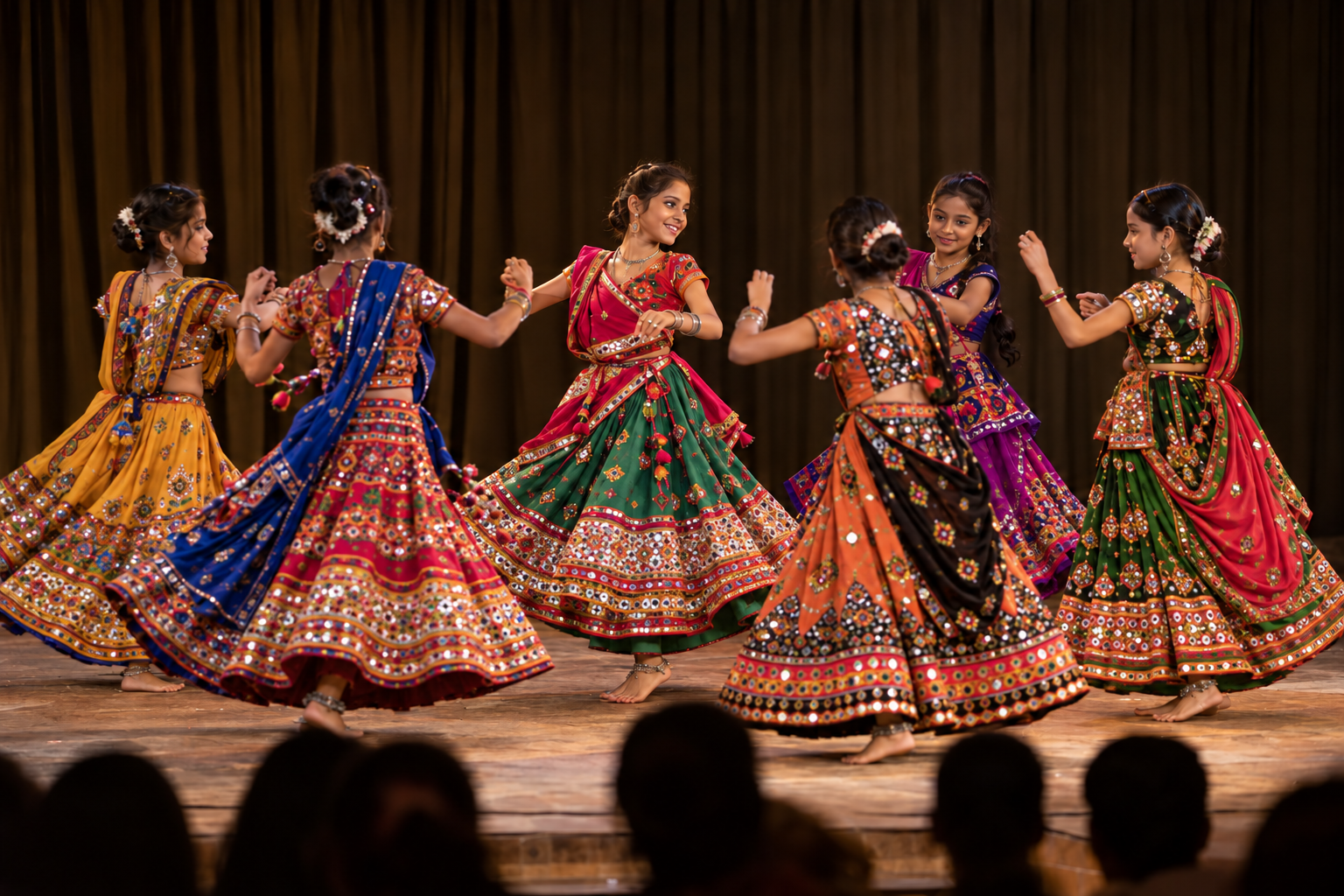 Students performing a garba dance on stage